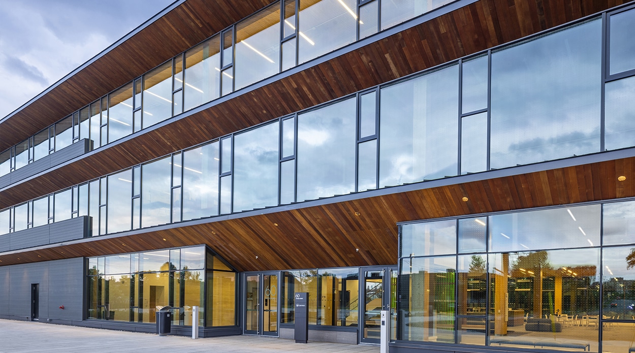 Photo of the OSSTF Headquarters and multi-tenant building showing large banks of bird safe windows made with AviProtek E bird friendly glass pattern 215 