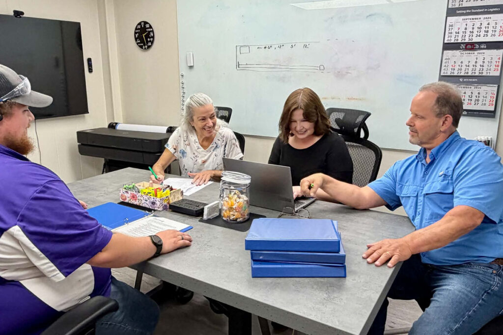 Office Workers In A Meeting At A Glass Manufacturing Company